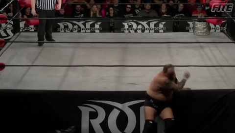 ROH #383 - A close line sends Silas Young and Beer City Bruiser through the ropes ROH #383 - A close line sends Silas Young and Beer City Bruiser through the ropes